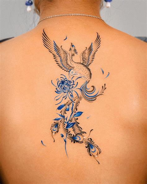 ave fenix resurgiendo de las cenizas tatuaje|50 ideas de tatuajes del ave de Fénix y su significado.